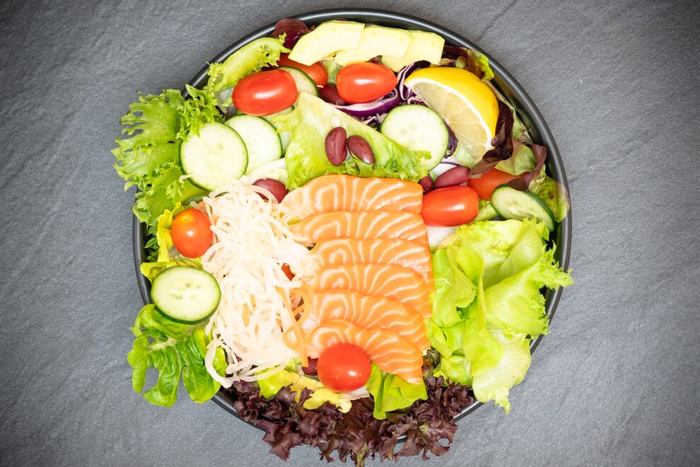 Delicious salad with salmon in the right nutrition menu for weight loss